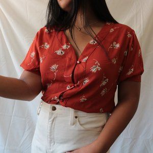 burnt orange floral blouse